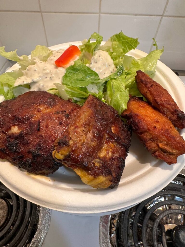 Jerk chicken and ribs with salad