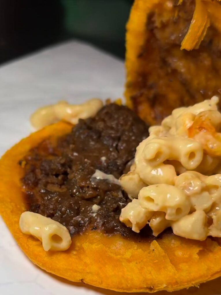 Plantain cup with brown stew and mac and cheese
